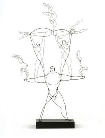 A wire sculpture of a family of acrobats